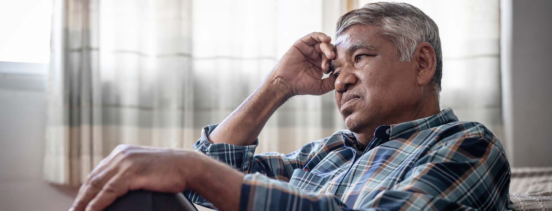 Healthcare professional reviewing patient symptoms for hATTR diagnosis